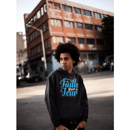 Unisex oversized Faith Over Fear hoodie, soft cotton-blend, relaxed fit, kangaroo pocket, stylish sustainable fashion.