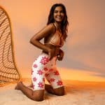 Women's floral biker shorts, high-waisted with pocket, vibrant red and white flowers, stretchy polyester spandex.