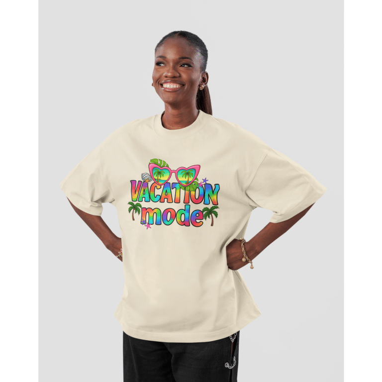 Oversized faded t-shirt in Vacation Mode with playful sunglasses and palm tree graphics, relaxed boxy fit, soft carded cotton.