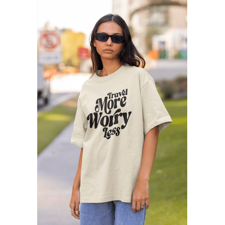 Oversized faded graphic tee 'Travel More Worry Less', garment-dyed cotton, boxy fit, dropped shoulders.