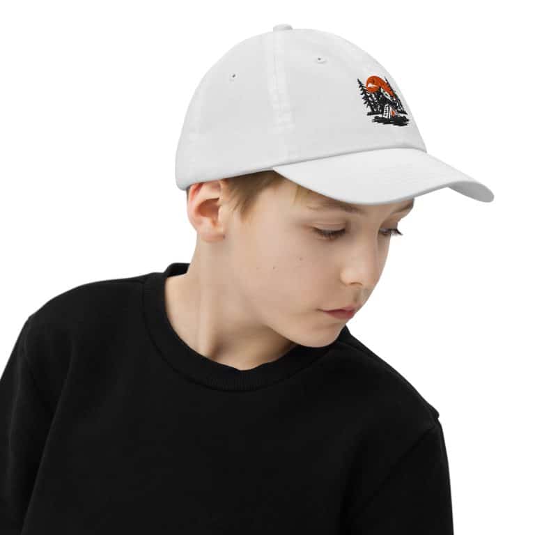 Sky-blue youth baseball cap with embroidered adventure design, bio-washed cotton twill, pre-curved visor, adjustable strap.