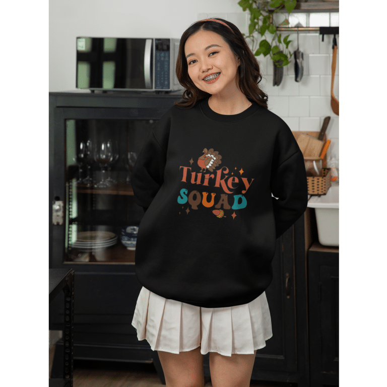 Warm and cozy unisex premium cotton sweatshirt featuring a playful turkey design, perfect for festive holiday gatherings and casual comfort.