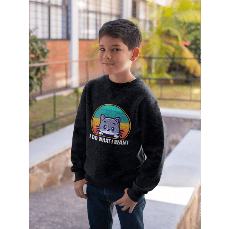 Cozy youth crewneck sweatshirt with 'I Do What I Want' graphic, regular fit, cotton-polyester fleece in white.