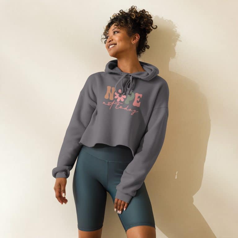 Women's crop hoodie with floral design and "Nope Not Today" text, raw hem, dropped shoulders, lightweight cotton-poly fleece.