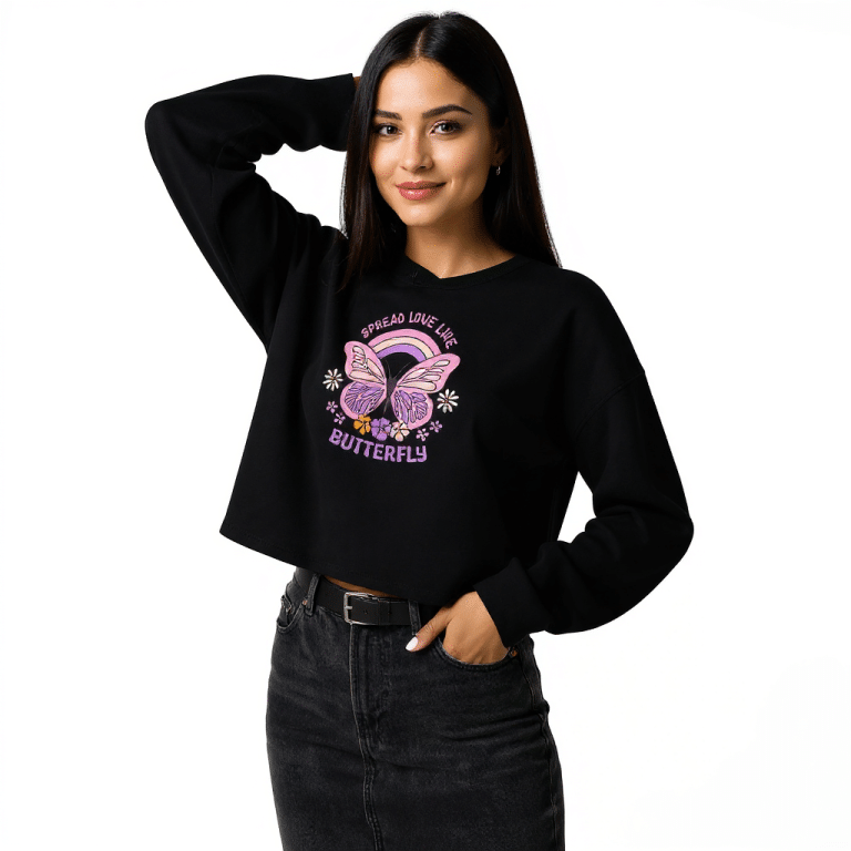 Soft pink crop hoodie with purple butterfly print, spread love slogan, relaxed drop shoulder fit.