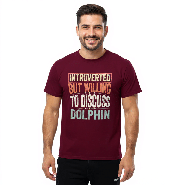 Gildan unisex classic tee in burgundy featuring "Introverted But Willing To Discuss Dolphin" phrase, 100% cotton