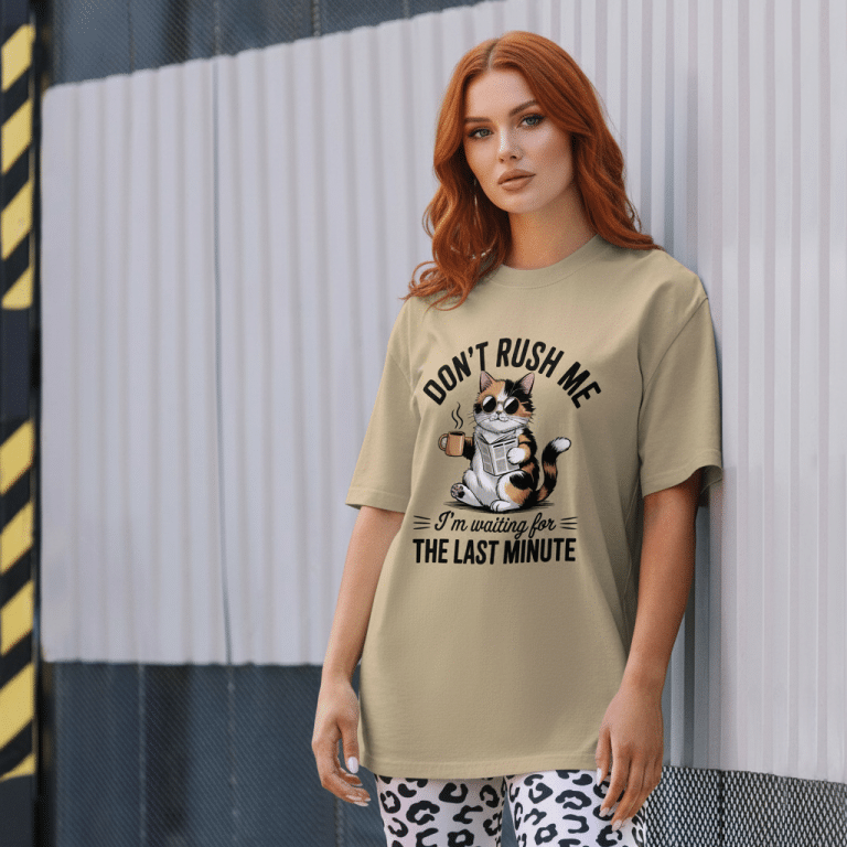 Garment-dyed oversized faded cotton t-shirt with 'Don't Rush Me' cat graphic, dropped shoulders, boxy fit.