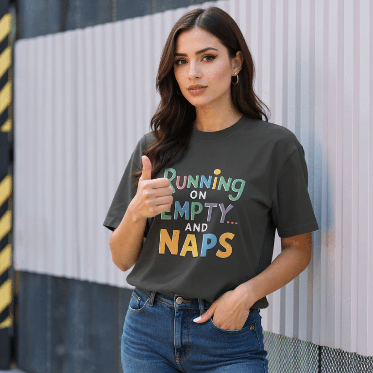 Oversized faded t-shirt with "Running on Empty and Naps" graphic, 100% carded cotton, boxy fit, dropped shoulders, garment-dyed.