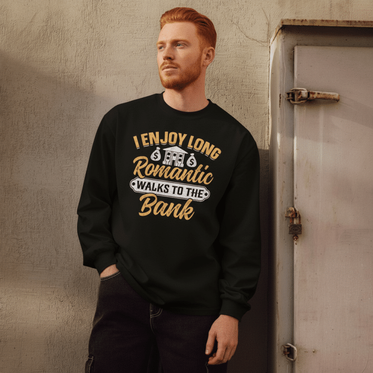 Premium heavyweight long sleeve shirt in black with graphic "I Enjoy Long Romantic Walks To The Bank" for casual style.